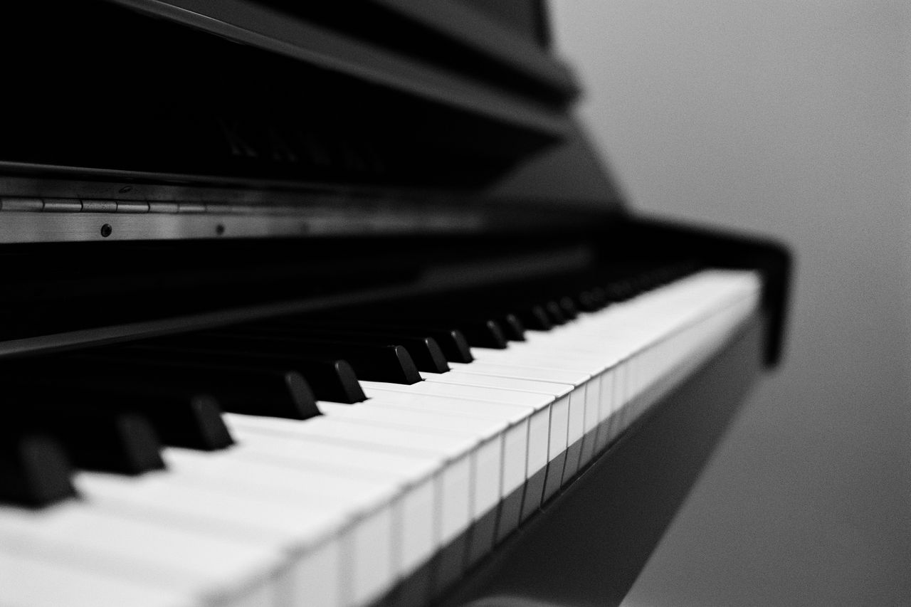 Elegant black and white photo capturing the timeless beauty of piano keys. Ideal for music lovers.
